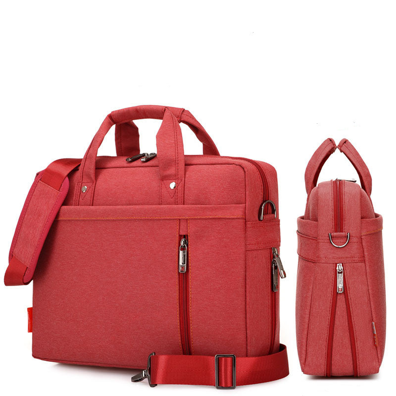Red waterproof oxford laptop bag with front zip panel, top handles, and crossbody strap