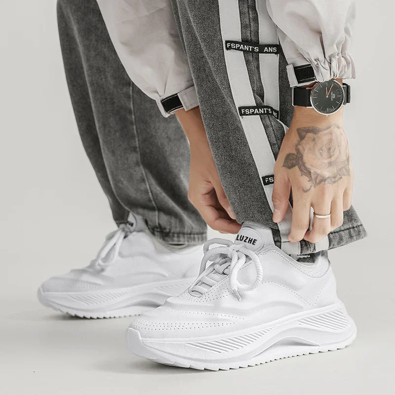 White low-top lace-up height-increasing sneakers worn with laces and rounded toe