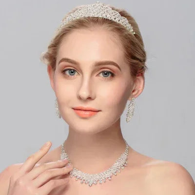 Bridal tiara with rhinestone necklace and matching dangling earrings on model