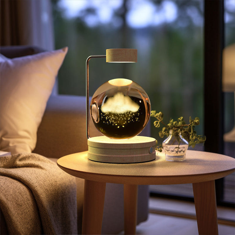 Crystal ball LED night light glowing inside clear glass dome atop a round wood base