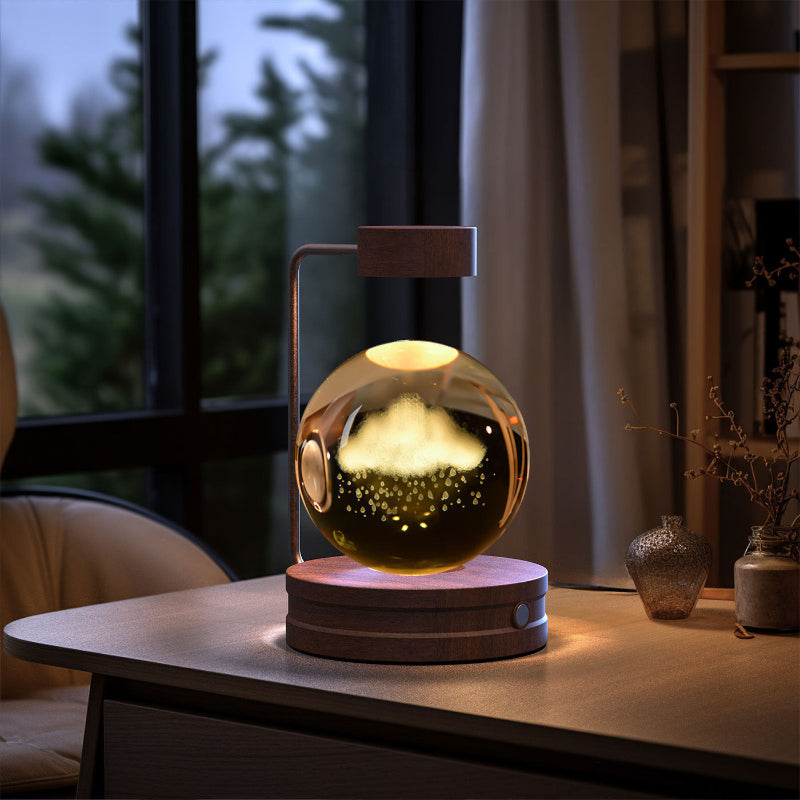 Crystal ball LED night light with glowing globe on round wood base, warm interior pattern