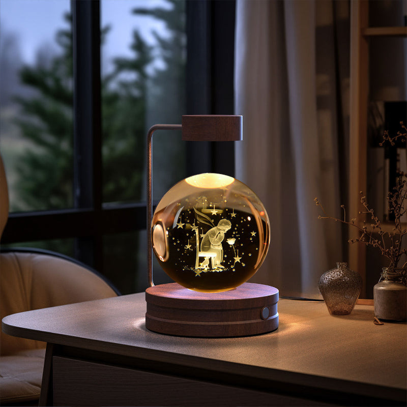 Crystal ball LED night light with glowing globe on round wood base, warm light inside