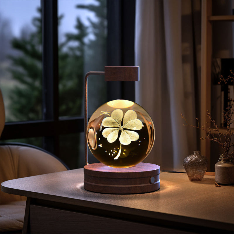 Crystal ball LED night light with clover glow, light wood base, clear globe