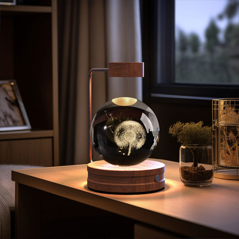 Crystal ball cosmic LED night light with glowing galactic pattern in dark glass globe