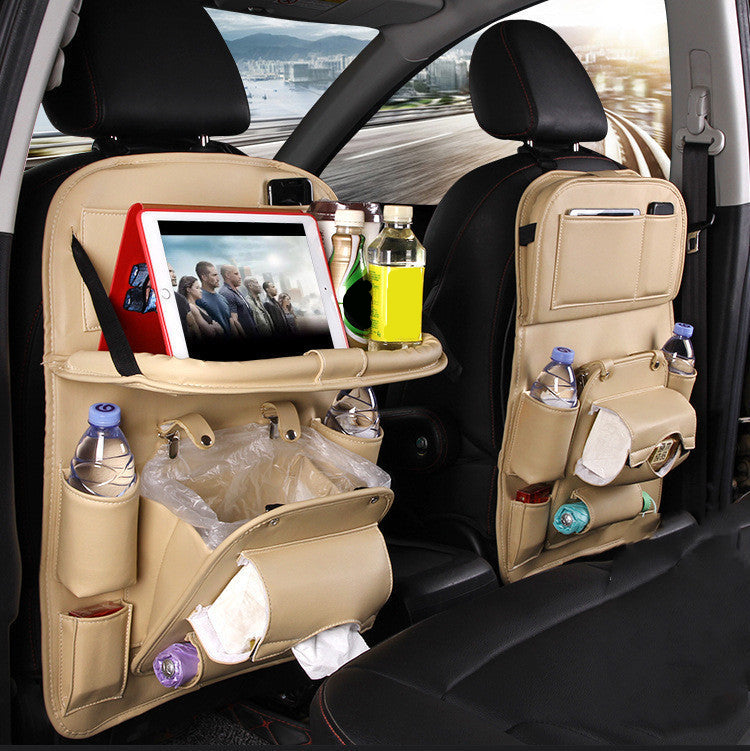 Beige PU leather car seat back organizer with tray, tablet holder, and multiple pouches