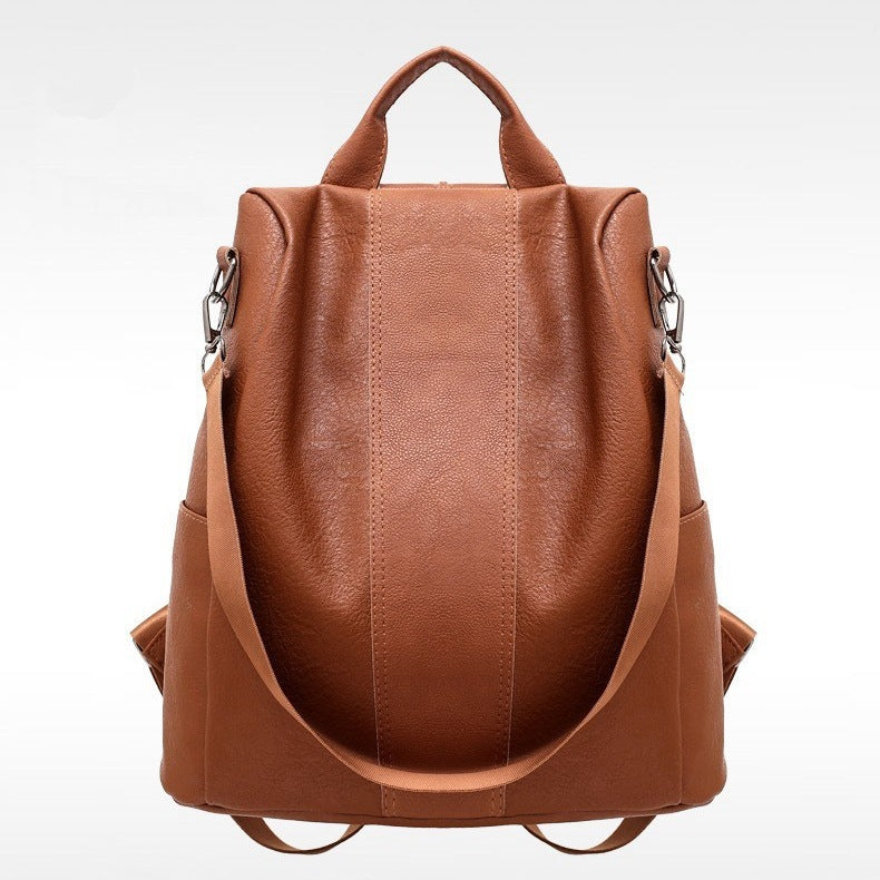 Brown leather backpack on a white background