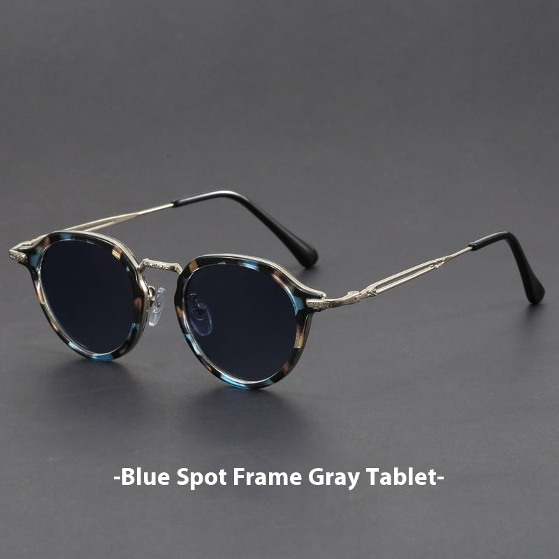 Unisex round metal sunglasses with silver frame and blue accents, dark lenses