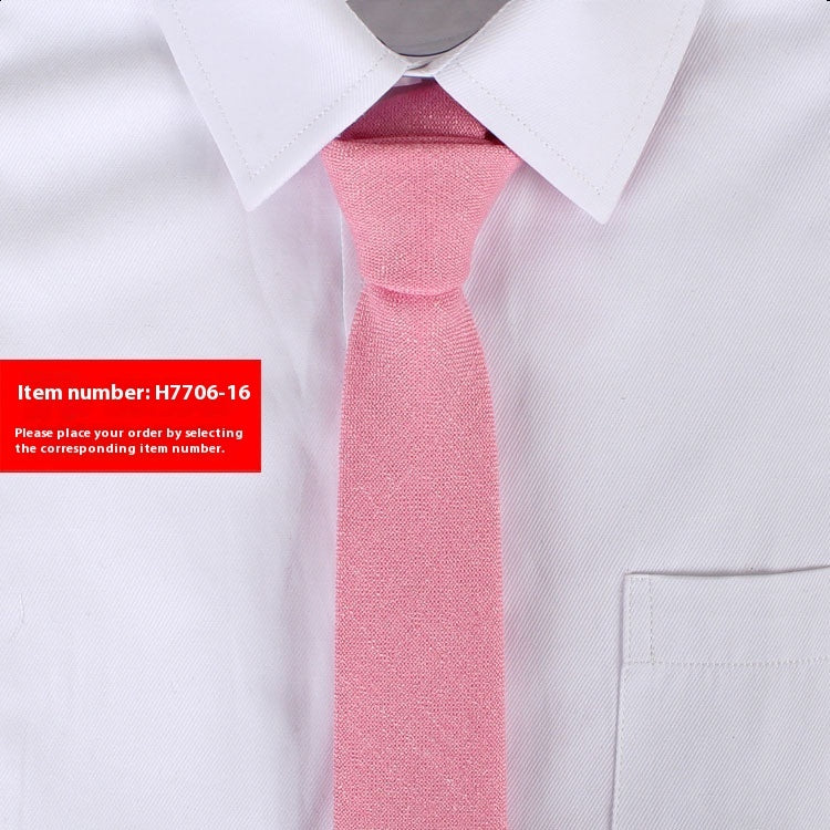 Narrow cotton tie in dusty pink, textured fabric, slim knot.