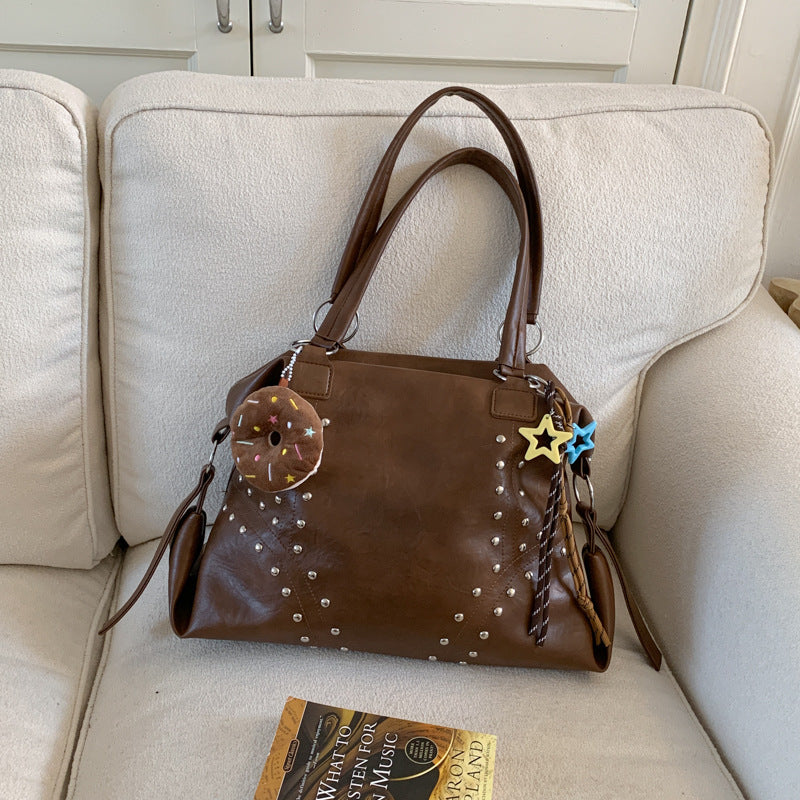 Women's shoulder bag, brown with studded dots and donut keychain, star charm at handle