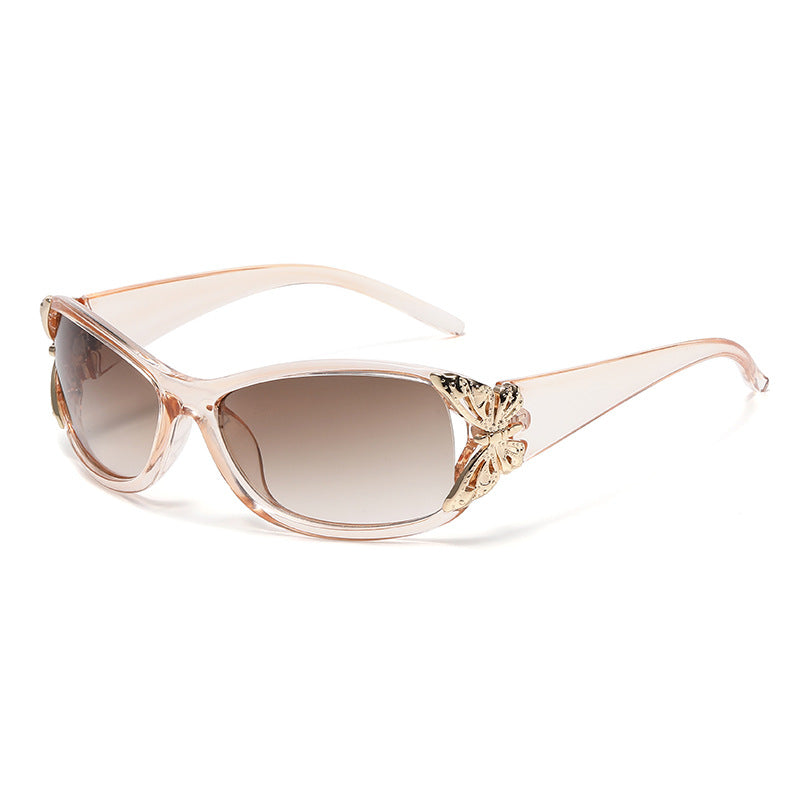 Clear rose driving sunglasses with gradient amber lenses and gold-tone floral bridge detail