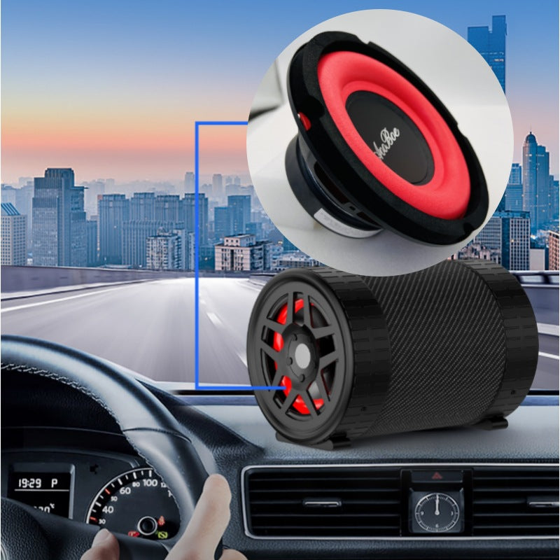 Black car speaker subwoofer with red cone and mounting base, angled view