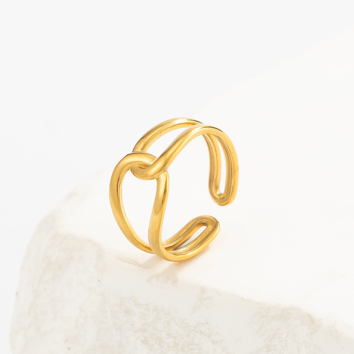 18K vacuum-plated gold interlocking loop ring with rounded open design