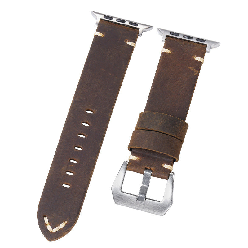 Dark brown leather watch straps with embossed detail, silver buckles, and multiple punched holes