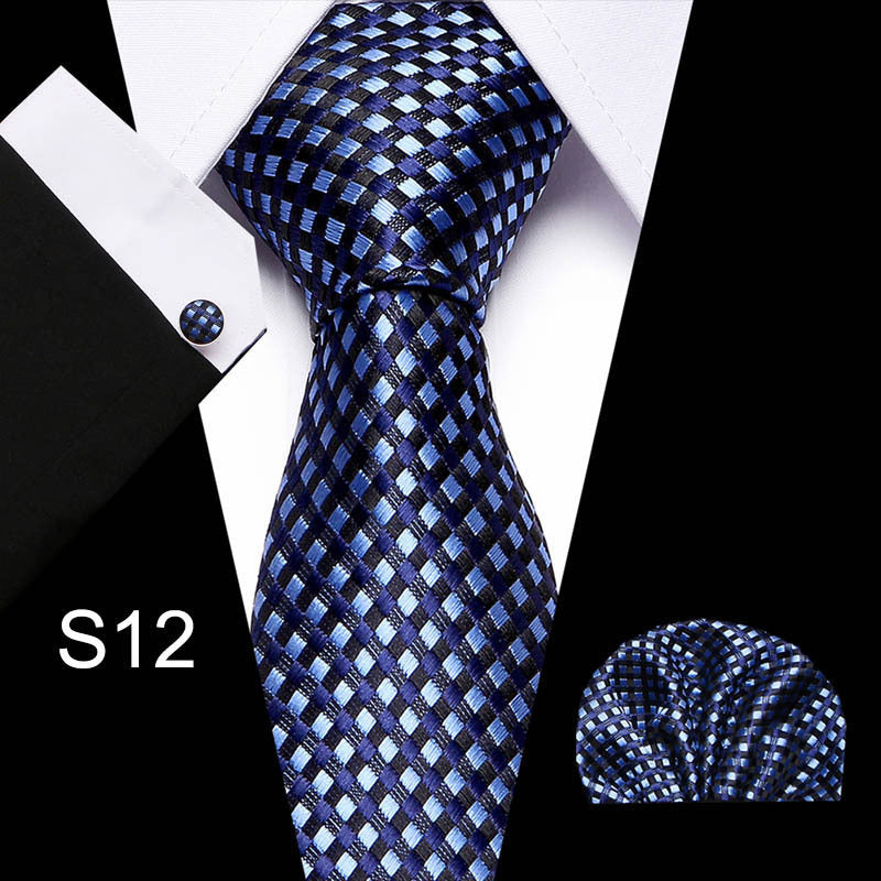 Business tie in blue with check pattern and matching pocket square.