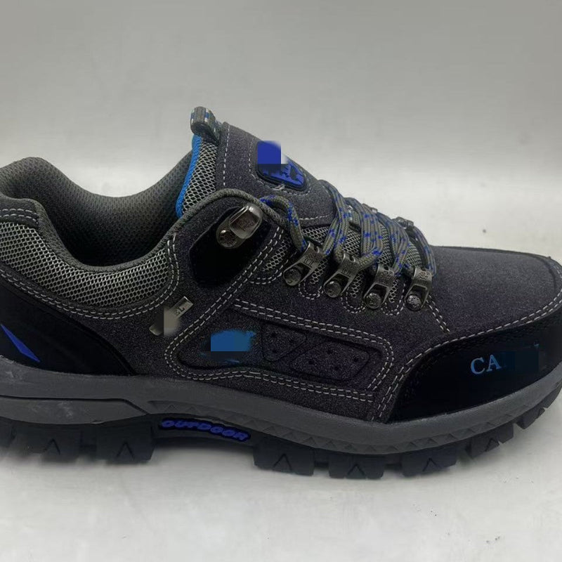 Black hiking shoe with blue accents, lace-up eyelets, padded collar, textured tread sole