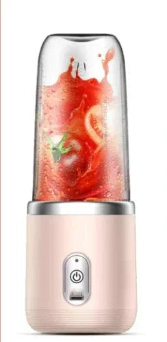 Portable 6-blade blender, pink base with clear blending cup and fruit contents