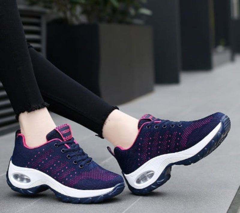 Navy and purple knit walking sneakers with black laces and white air-cushion sole