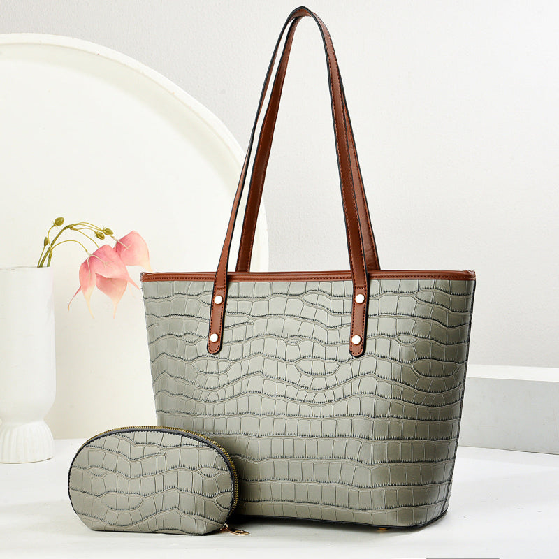 Gray croc-texture PU tote with zip pouch, wide handles, snap-front strap