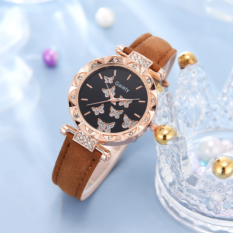 Women’s butterfly quartz watch with black dial and brown leather strap