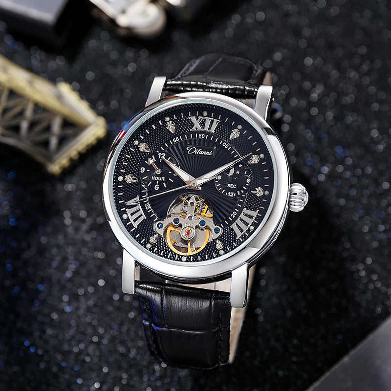 Mechanical watch with black dial, silver case, black leather strap; visible skeleton movement