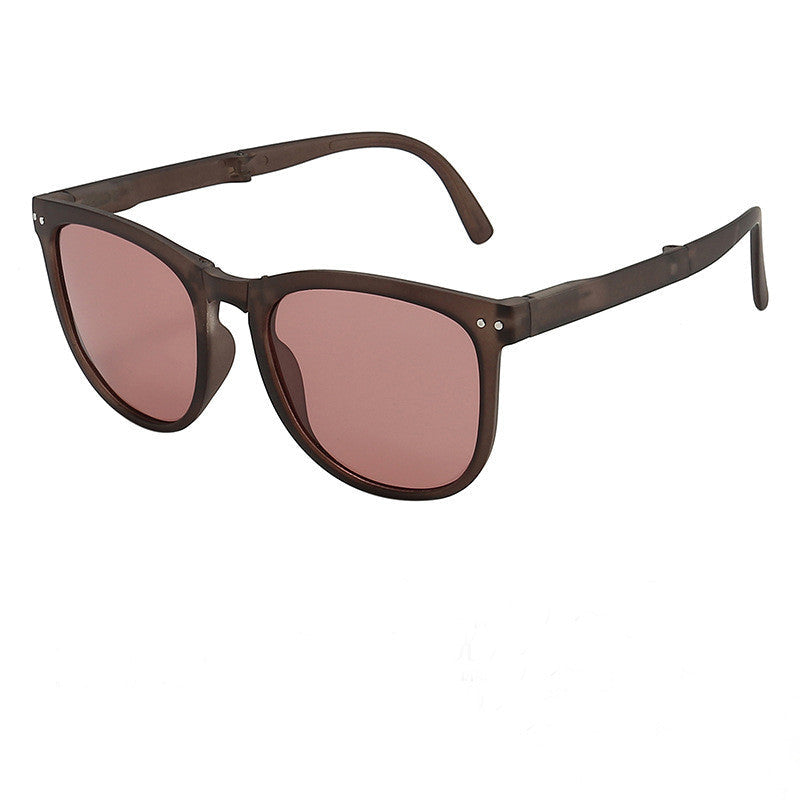 Dark brown polarized folding sunglasses with pink tinted lenses
