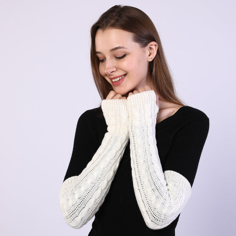 Twist-knit fingerless arm sleeves in cream, textured twist cuffs