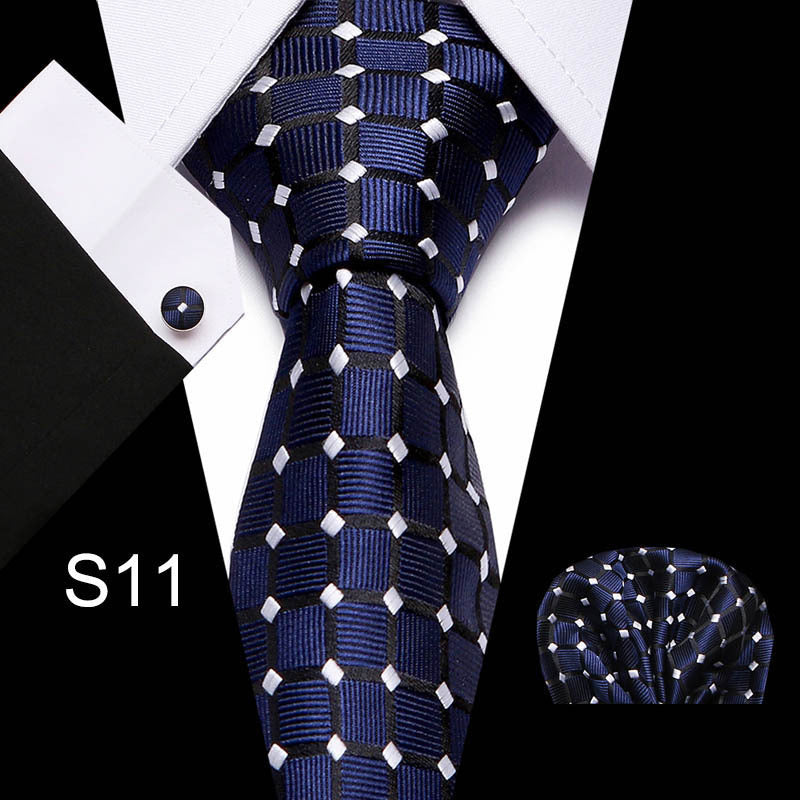 Business tie in navy with white geometric pattern and matching pocket square.