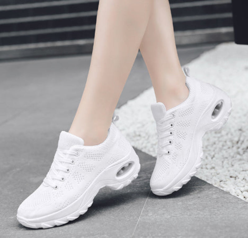 White knit walking sneakers with button-eyelets and round air-cushion detail