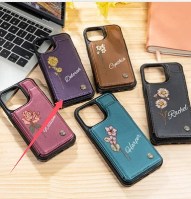 Pink floral phone case with camera cutout, metal button, and stitched edge.