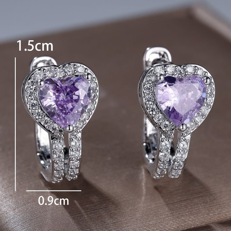 Heart-shaped ear clips with purple heart stones and silver pavé setting
