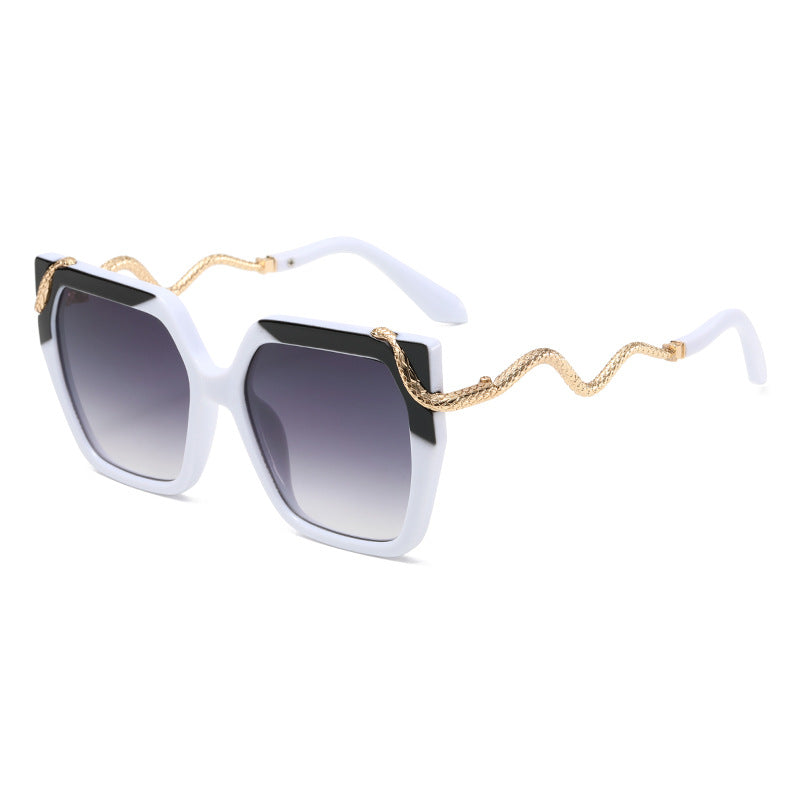Square white sunglasses with dark gradient lenses and gold snake temple arms