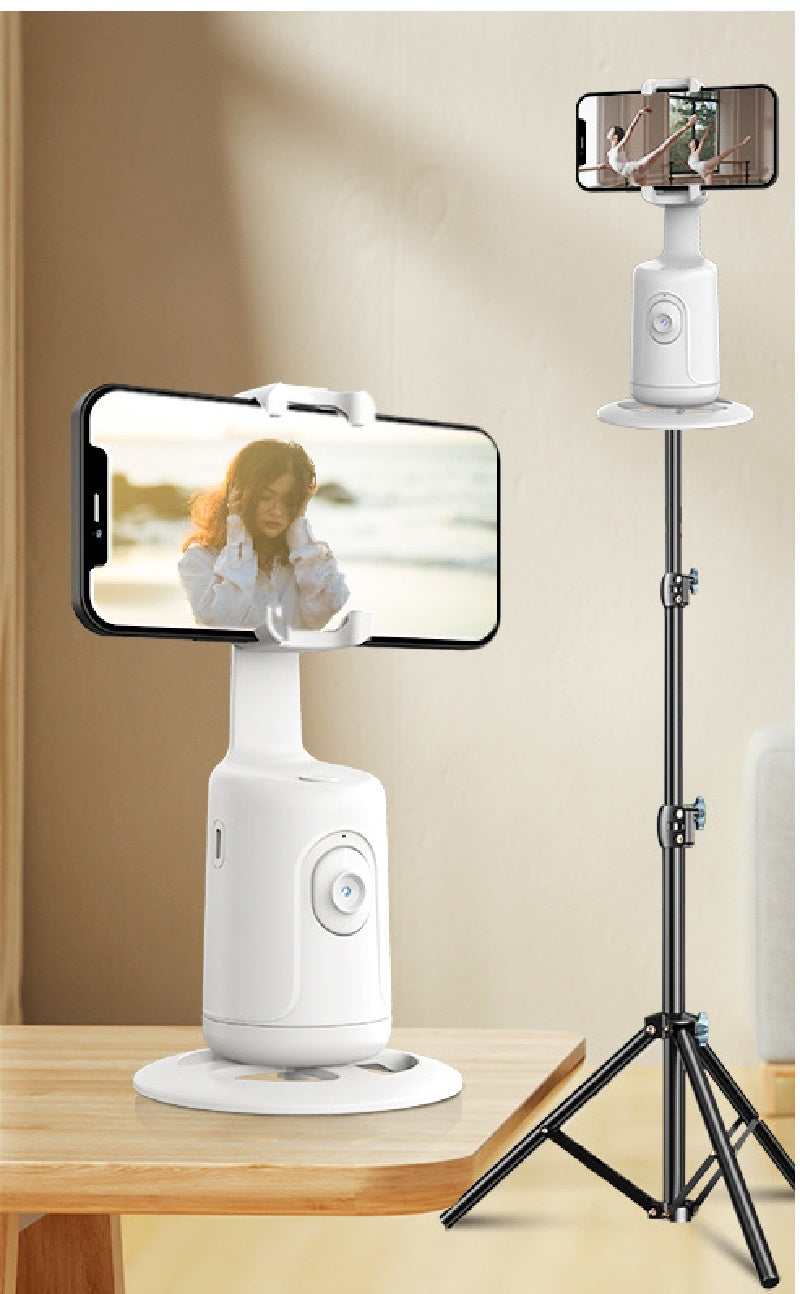 White phone holder stand with mounted smartphone and selfie-style clamp