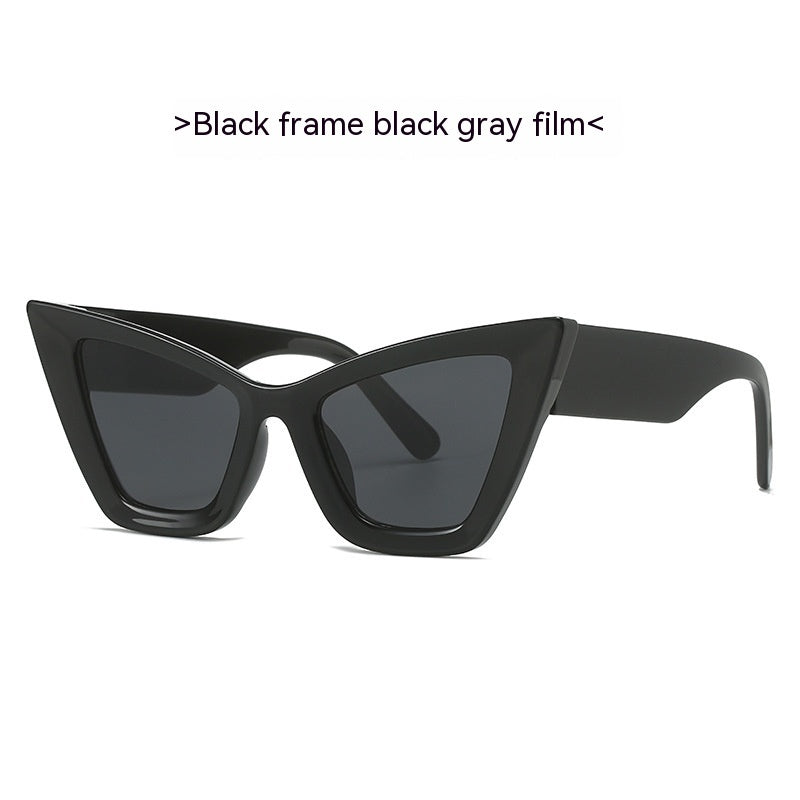 Black cat-eye sunglasses with dark gray tinted lenses and matte frame