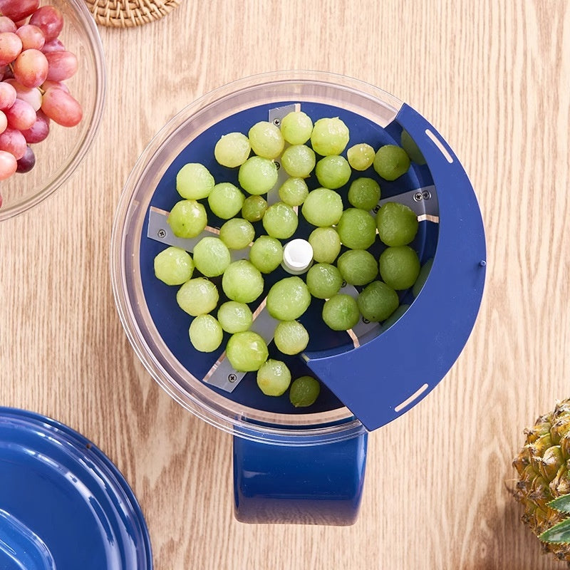 Blue grape peeler lid with clear chamber insert filled with green grapes