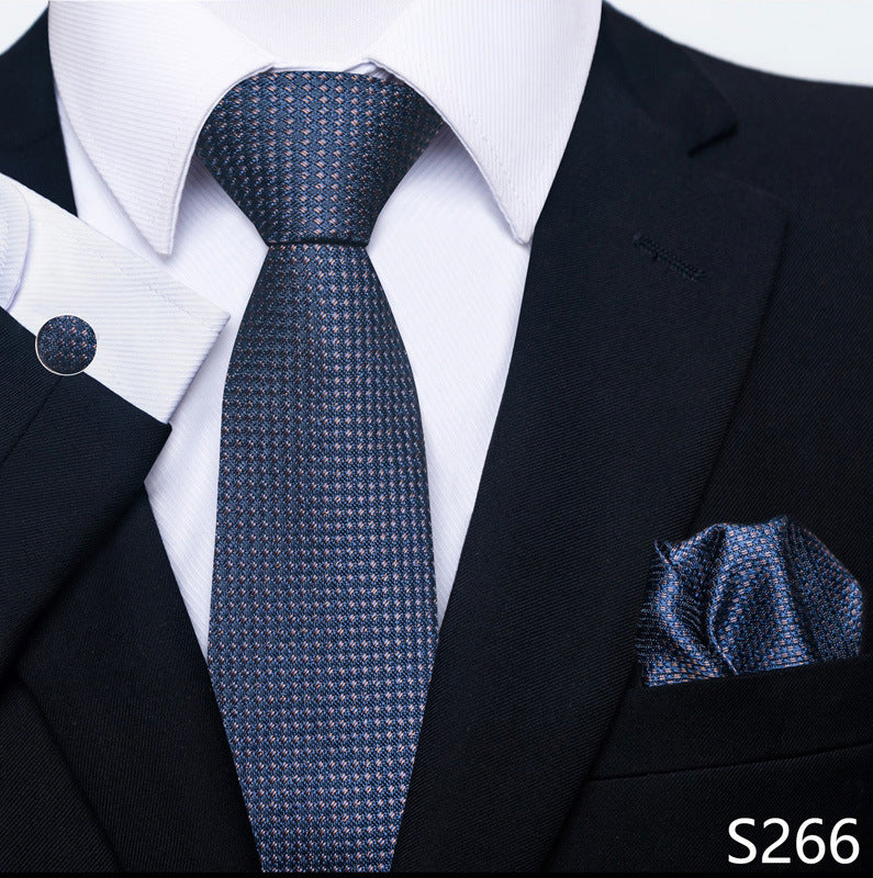 Men's formal tie set with navy patterned tie and matching pocket square, cufflink