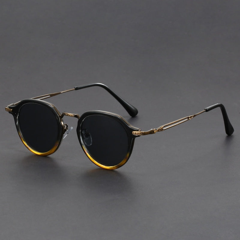 Unisex round metal sunglasses with leopard-print lower frame and dark lenses