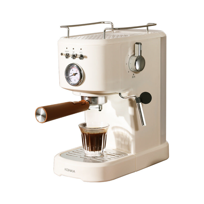 Cream countertop coffee maker with brown brew spout, front dial, and drip tray