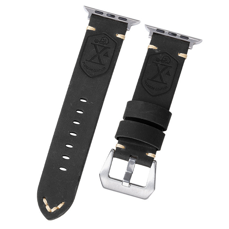 Black leather watch straps with embossed shield logo, silver buckles, and perforations