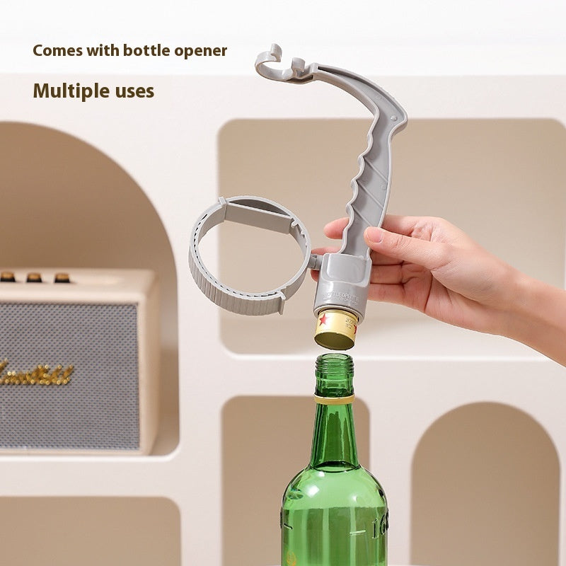Bottle handle holder with bottle opener; hand removes a cap from a green bottle