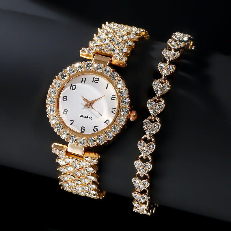 Rose-gold-tone stone-set watch and matching heart-link bracelet on a dark background