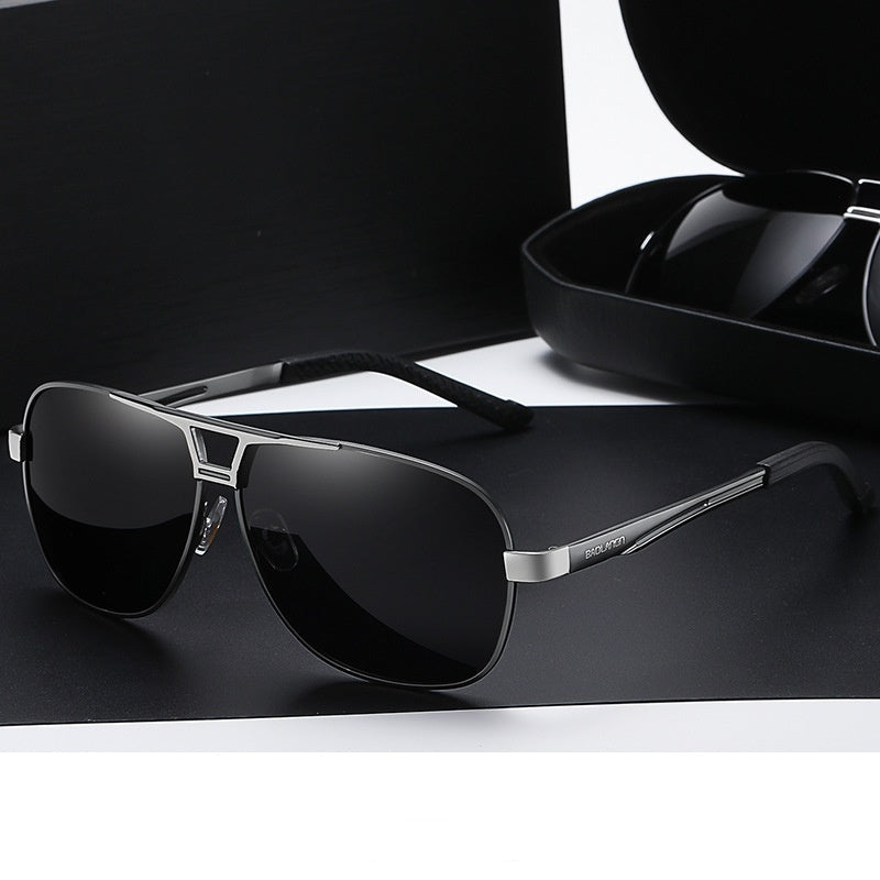 Polarized sunglasses with dark gray frame and black lenses, straight arms