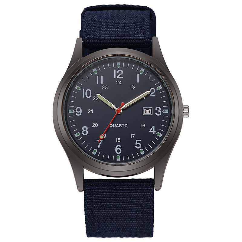 Quartz wristwatch with navy canvas strap and dark navy dial, date window at 3 o’clock.