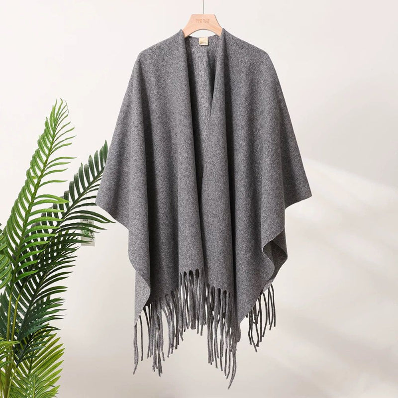 Heather gray tassel-fringe travel cape with draped front and open neckline