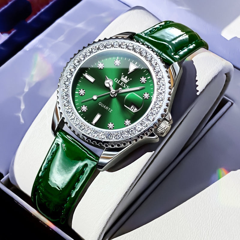 Quartz wristwatch with green dial, crystal bezel, and glossy green leather strap