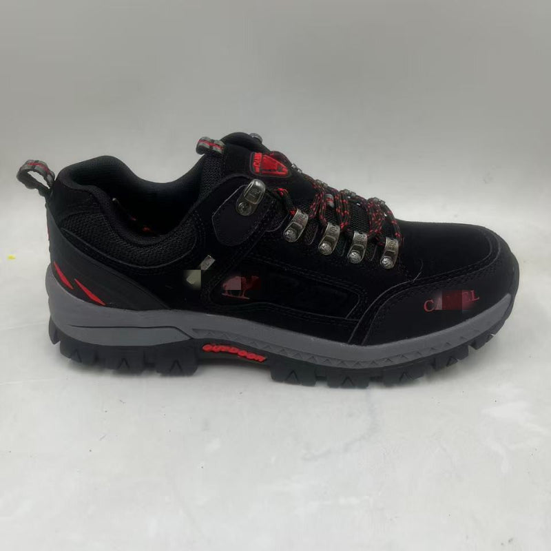 Black hiking shoe with red lace-up details, padded collar, rugged rubber tread outsole