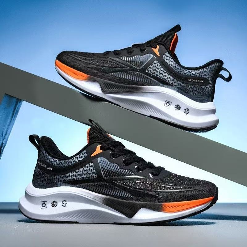 Men's mesh sneakers in black with gray and orange accents, lace-up, side view