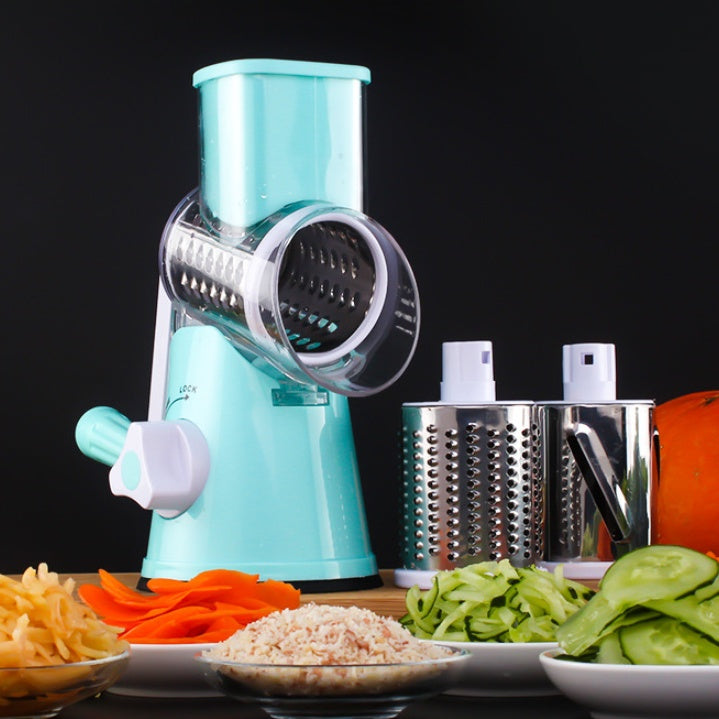 Teal manual rotary slicer with stainless grating blades and vegetable cutting cups