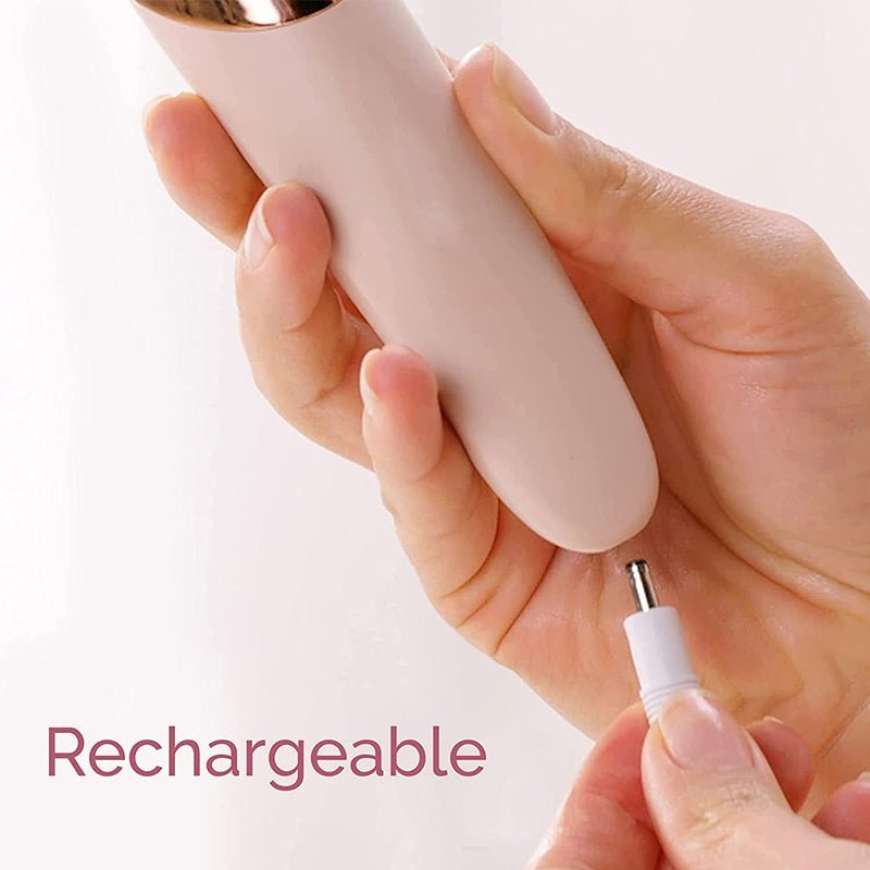 Electric foot callus remover in hand with white charging plug attachment