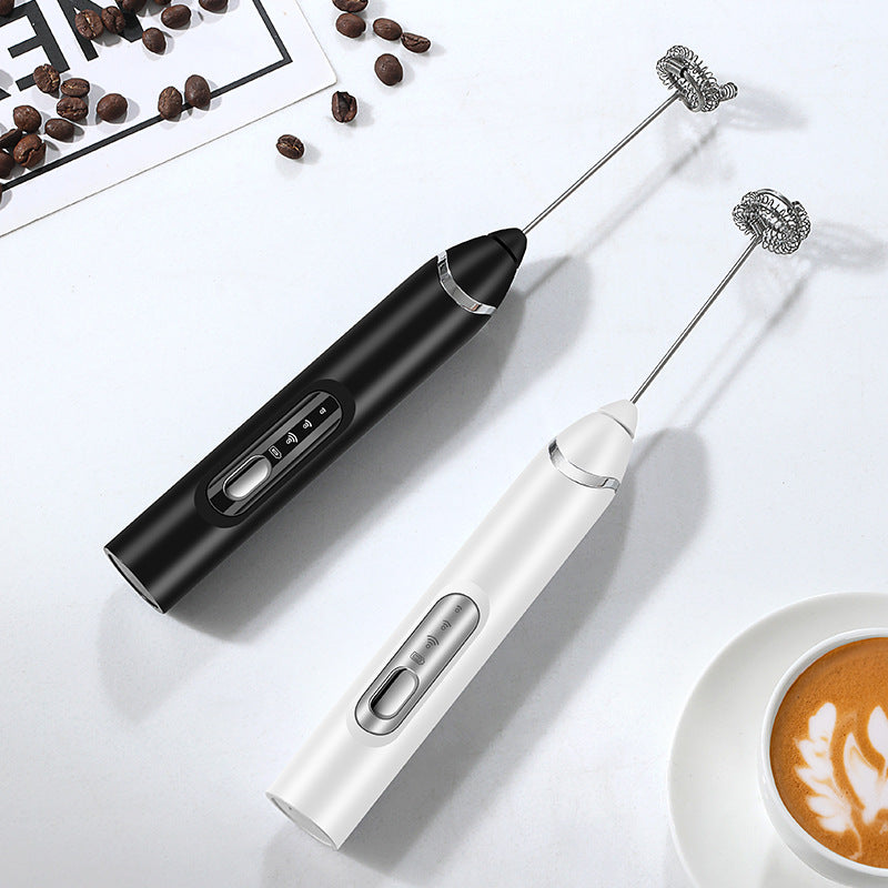 Black and white handheld electric milk frothers with whisk rod attachments