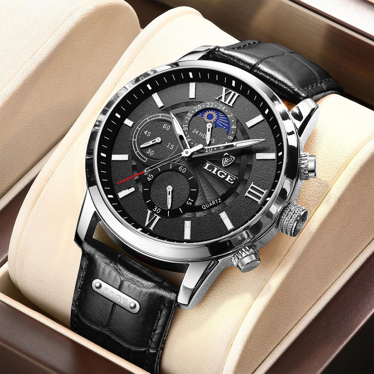 Silver chronograph quartz watch with black dial and black leather strap
